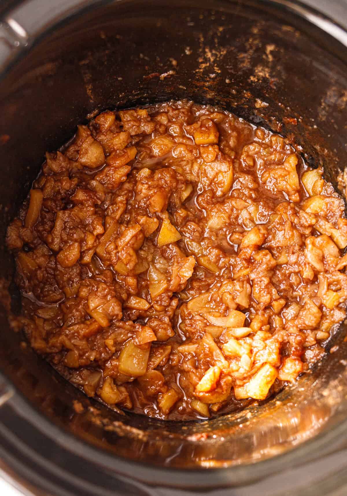 Chunky crockpot applesauce in the slow cooker after cooking