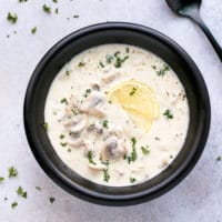 A PORCELAIN SOUP BOWL, FULL WITH CREAMY MUSHROOM SOUP RECIPE WOLFGANG PUCK