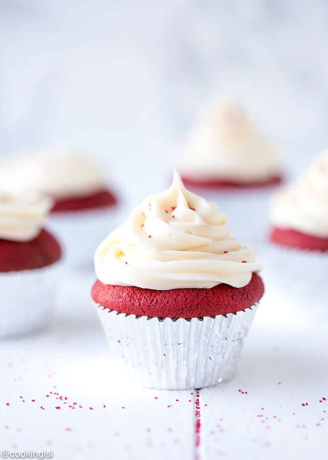 Easy Red Velvet Cupcakes Recipe - gorgeous, moist and crumby, topped with a white swirl of cream cheese frosting.