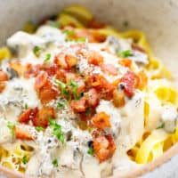 Tagliatelle with bacon and mushrooms in a bowl