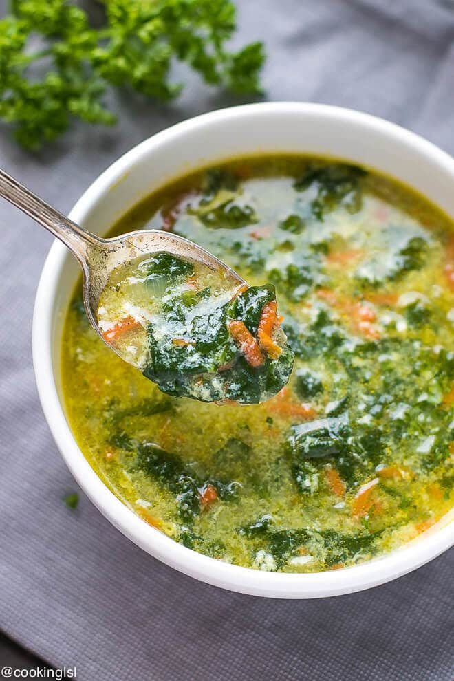 Bulgarian spinach egg drop soup, straccietella soup. A spoon full of healthy, low fat spinach egg drop soup.