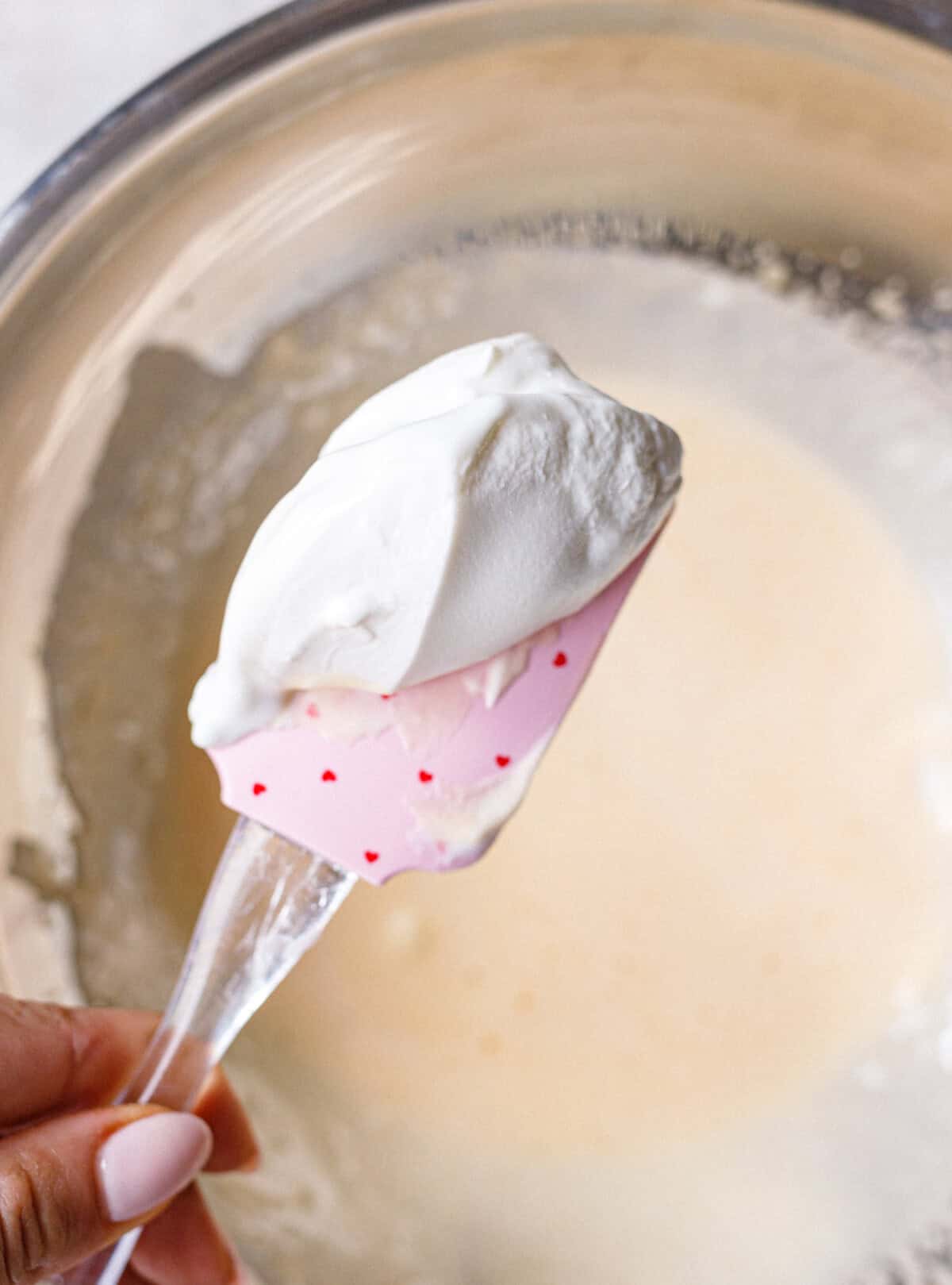 Strained yogurt beaten into the egg yolk mixture until smooth
