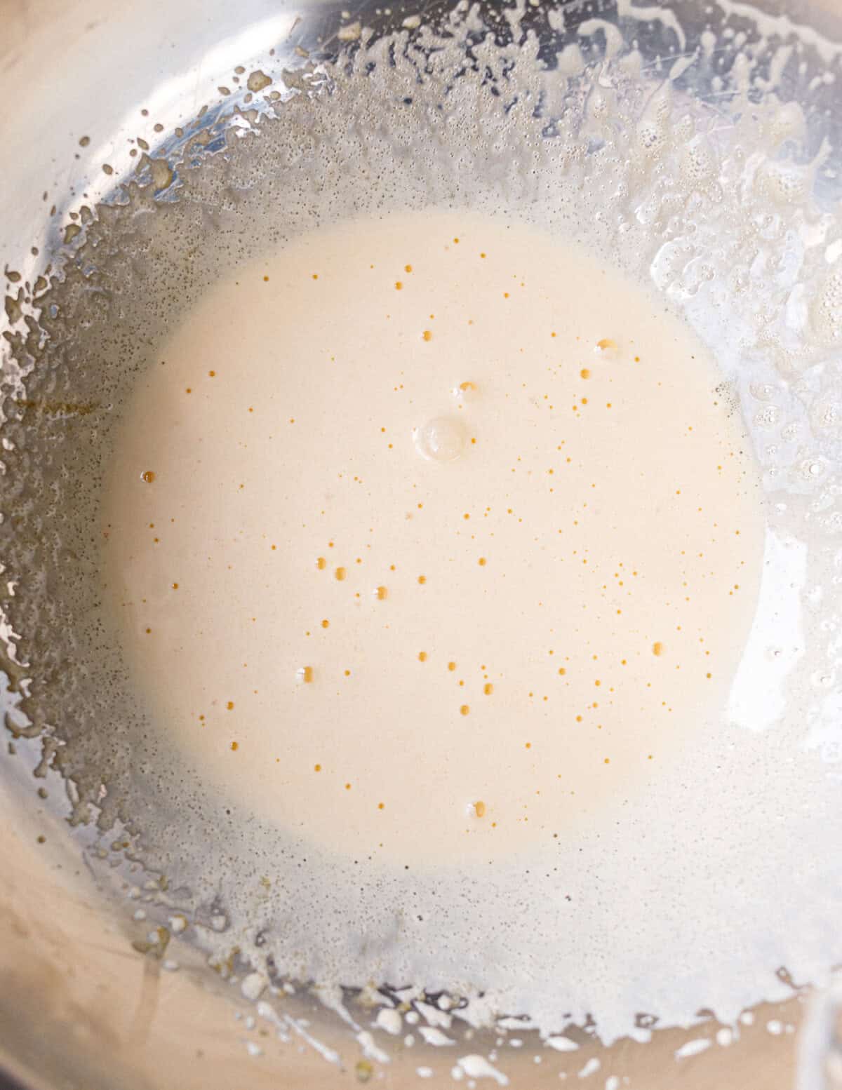 Egg yolks beaten with sugar until pale and frothy for no bake yogurt cake