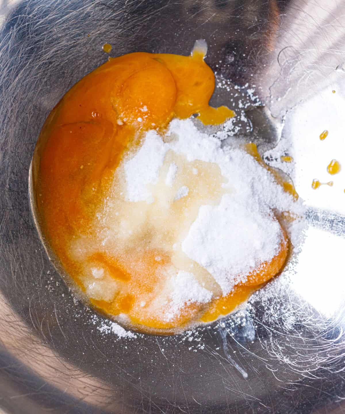 Egg yolks and powdered sugar in a bowl before beating for yogurt cake