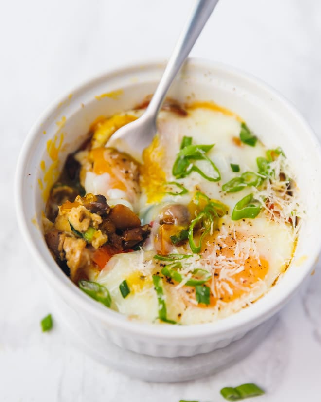 Baked Eggs In Ramekins With Mushrooms, Peppers And Green Onions image