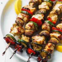 grilled Chicken Kabobs With Mushrooms, Zucchini And Peppers on a plate