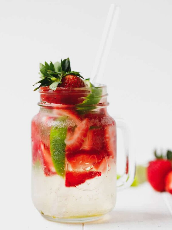 Strawberry mojito in a glass jar with a straw