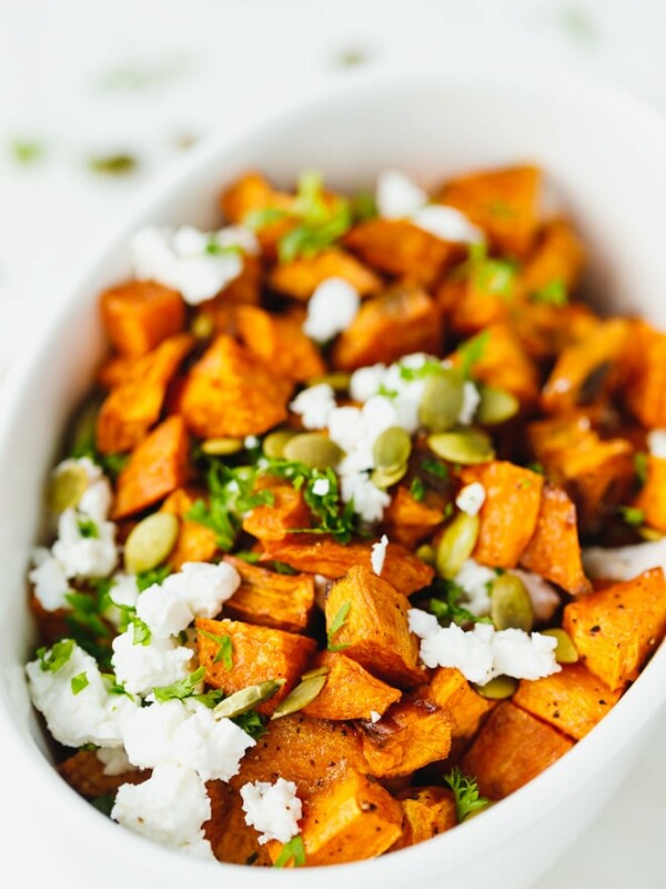 Roasted sweet potatoes in a white ceramic bowl
