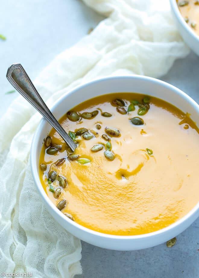 White bowl with warm This roasted butternut squash soup .