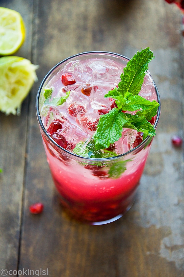 Simple and impressive Pomegranate Mojito Cocktail Antioxidants with fresh limes on the side