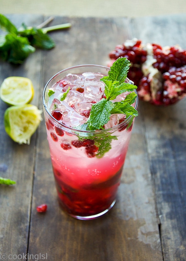 pomegranate mojito cocktail in a tall clear glass for a party