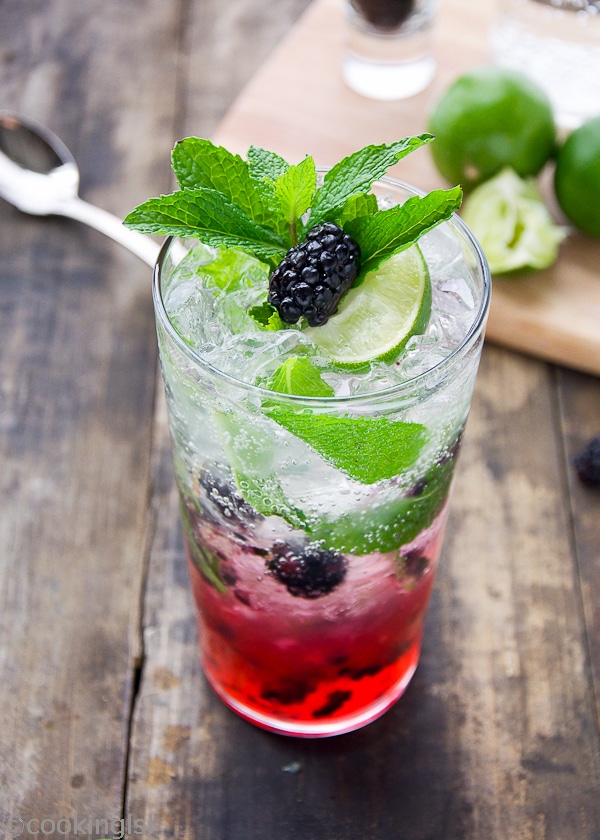 Blackberry Mojito in a tall glass with mint