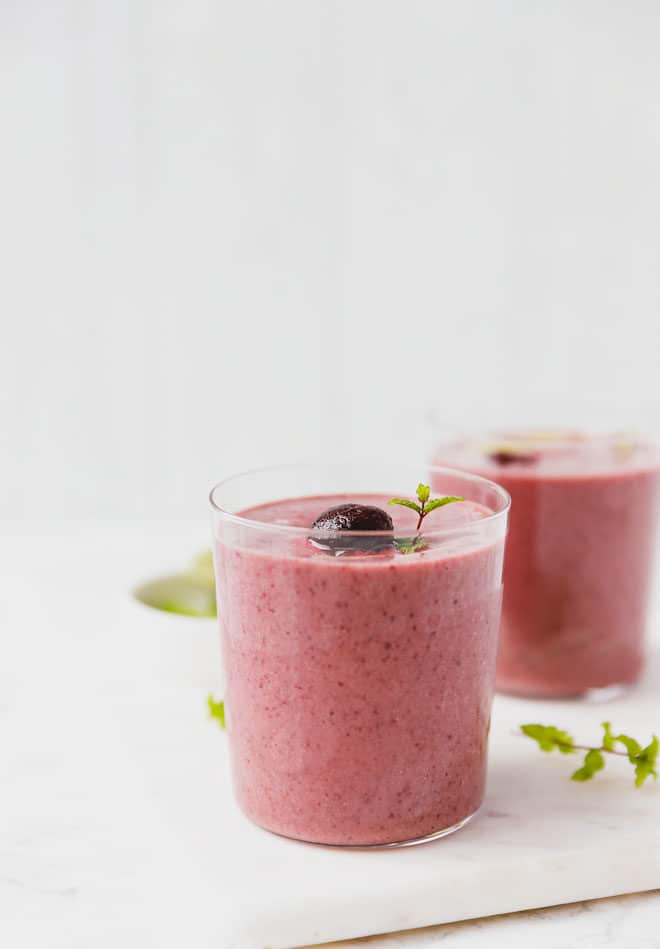 Creamy cherry smoothie with lime in a glass