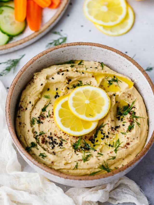 Roasted garlic hummus topped with sliced lemon