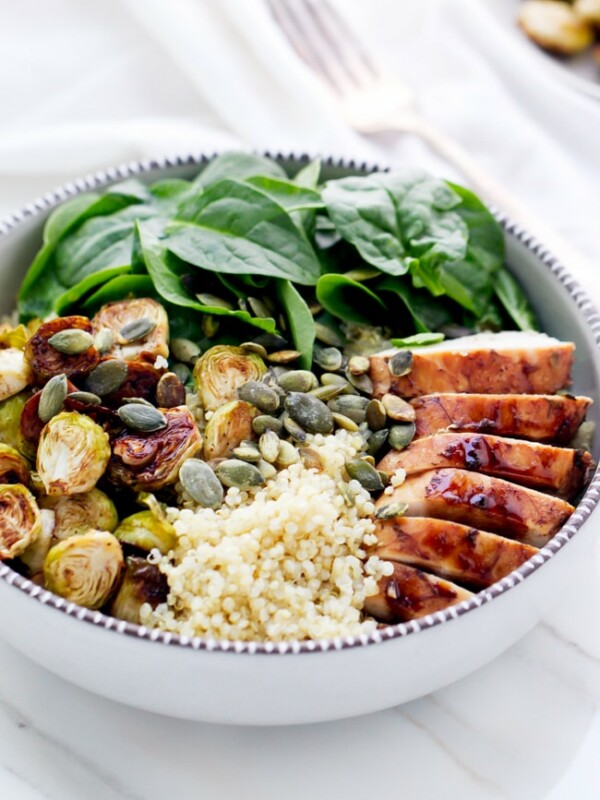 Balsamic Brussels Sprouts And Chicken Spinach Quinoa Bowls - in a ceramic bowl, with quinoa