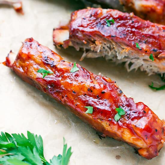 Oven Baked St Louis Style Ribs Recipe - made in the oven, covered in bbq sauce, these ribs are so tender, sticky and delicious! 