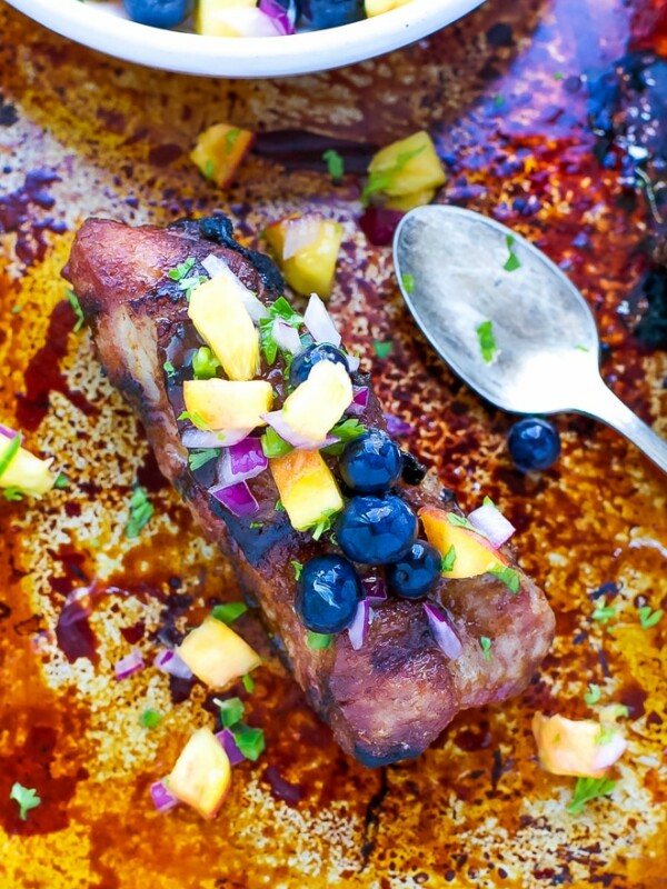 Grilled pork shoulder ribs with blueberry peach salsa