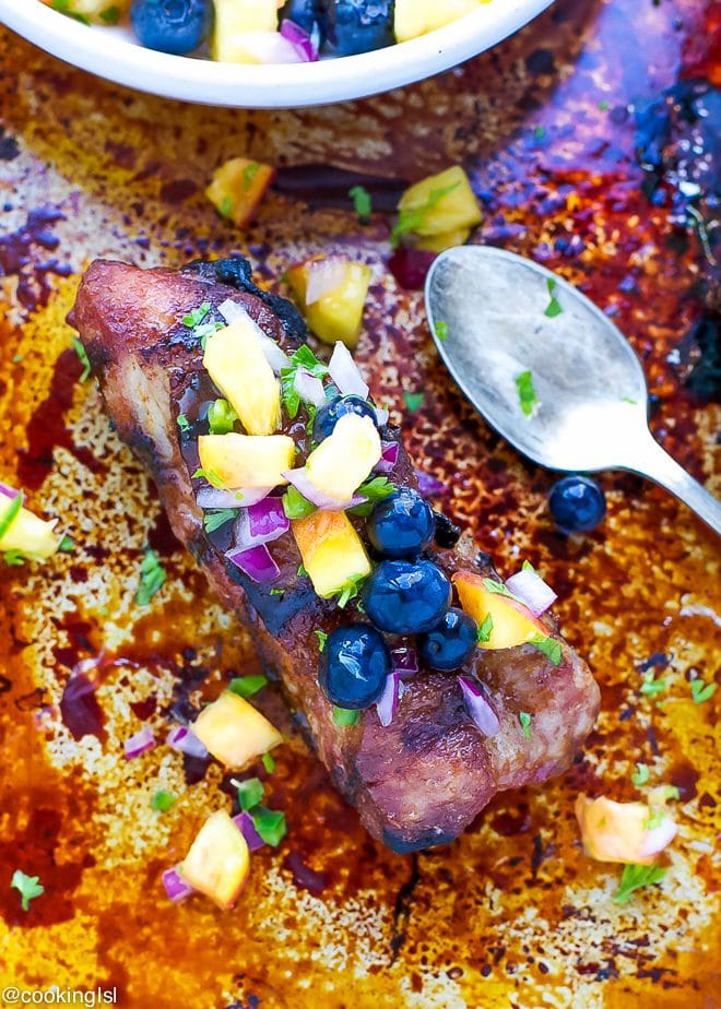 Grilled pork shoulder ribs with blueberry peach salsa