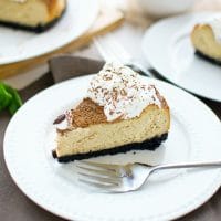 Tiramisu Cheesecake - Luscious, creamy and sweet coffee infused cheesecake with crumby Oreo cookie crust. Dusted with cocoa powder and topped with whipped cream, it combines two popular desserts - Tiramisu and Cheesecake.