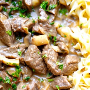 beef stroganoff in a pan with noodles