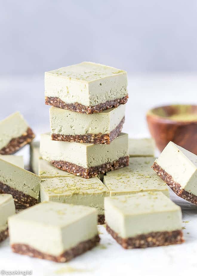 Green Tea Powder Matcha Cheesecake Squares With Nut and Fruit Crust, on top of each other, no bake, vegan gluten free clean dessert