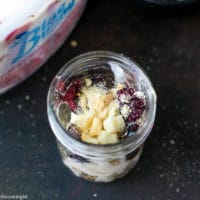 Cherry Sundae Recipe - step by step photos. Mason Jar with crushed cookies, Blue Bunny® Ice cream, fresh cherries and chopped almonds.
