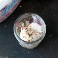 Cherry Sundae Recipe - step by step photos. Mason Jar with crushed cookies, Blue Bunny® Ice cream and chopped almonds.