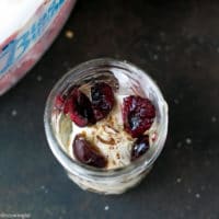 Cherry Sundae Recipe - step by step photos. Mason Jar with crushed cookies, Blue Bunny® Ice cream , fresh cherries and chopped almonds.