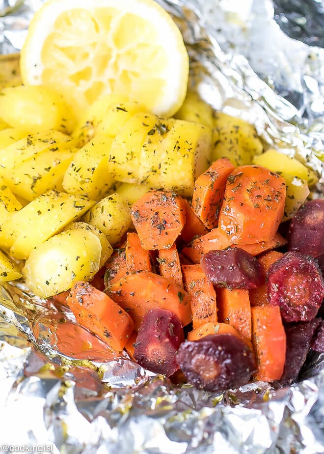 Foil packets with grilled carrots in foil recipe, a mix of orange, yellow and purple carrots, great for a side dish.