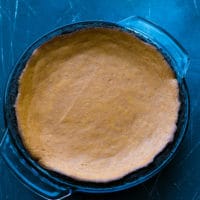 Ingredients for Dark Chocolate Pumpkin Pie With Chocolate Crust Recipe.Baked pie.