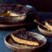 Two sliced on pumpkin pie for the holidays. Light and easy to make. Dark Chocolate Pumpkin Pie With Chocolate Crust Recipe.