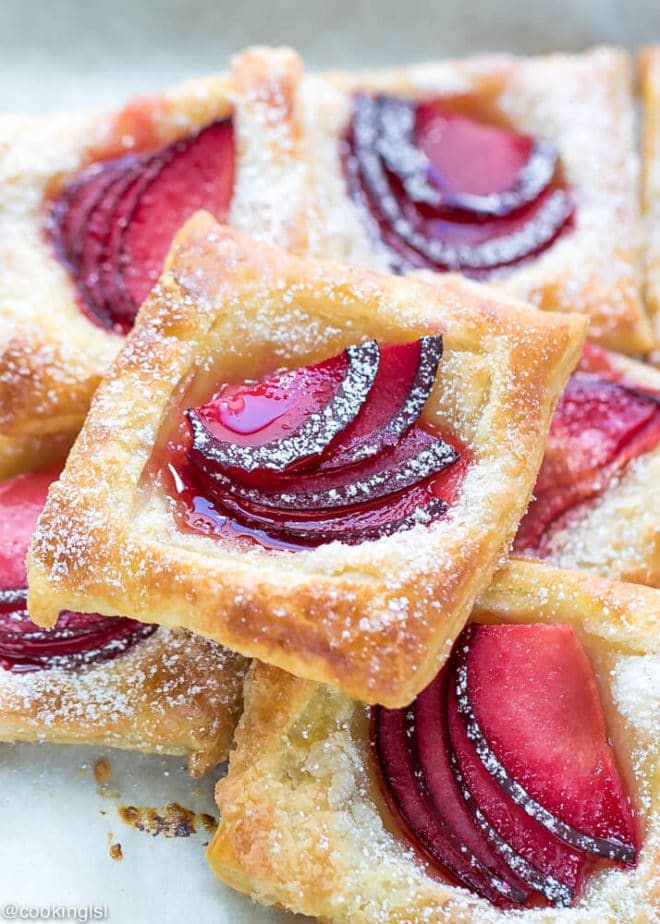 Easy Mini Plum Tarts Recipe With Puff Pastry. Sliced of plums, colorful, flaky, delicious, party food.