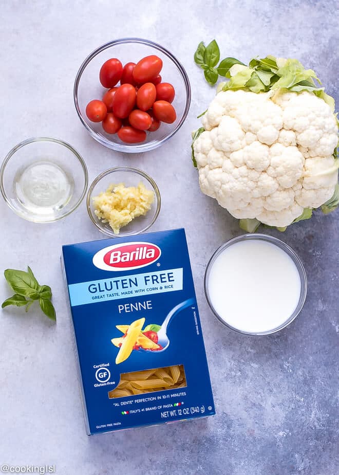 Blue box with Barilla Gluten Free Penne pasta. Penne Pasta With Cauliflower Alfredo Sauce Recipe and ingredients for the sauce.
