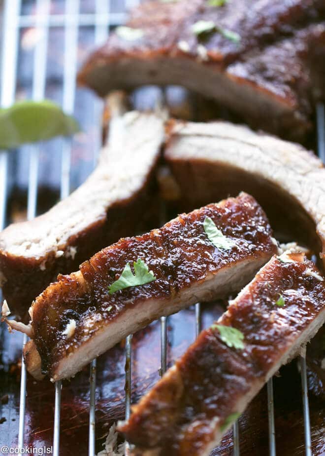 Soy Honey Glazed Pork Ribs Recipe. Smithfield All Natural baby back ribs, on a wire rack, brushed with honey soy sauce, cut into pieces.