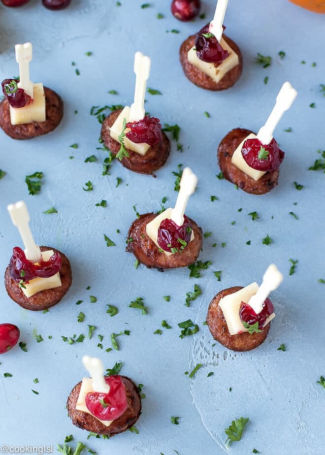 Andouille Sausage Appetizer Bites With Cranberry Cheddar. Appetizer bites skewered with mini wooden picks.