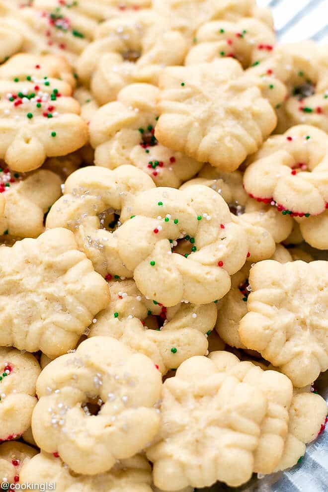 Easy Cream Cheese Spritz Cookies Recipe , made with OXO cookie press, in the shape of wreaths and Christmas trees.