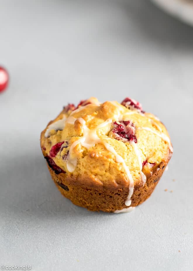Healthy Cranberry Orange Muffins Recipe Refined Sugar Free - with refined sugar free maple glaze on a tray.