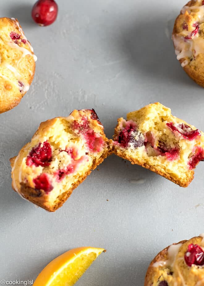 Healthy Cranberry Orange Muffins Recipe Refined Sugar Free cut in half, with cranberries inside.