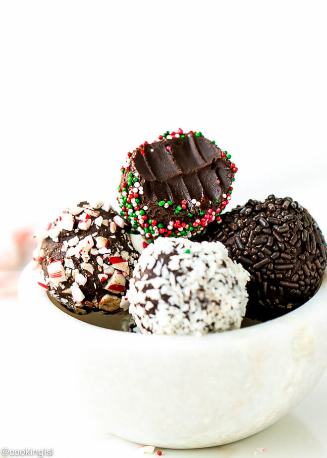 a small white marble bowl full with truffles. Dark chocolate peppermint truffles recipe.