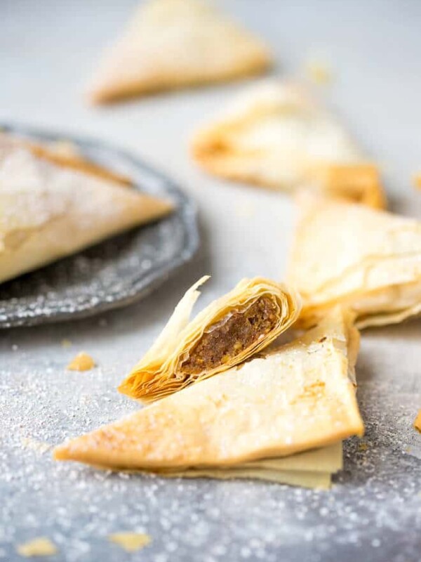 Pumpkin Phyllo Triangles Recipe. Filo pastry triangles cut in half, dusted with powdered sugar and served with coffee.