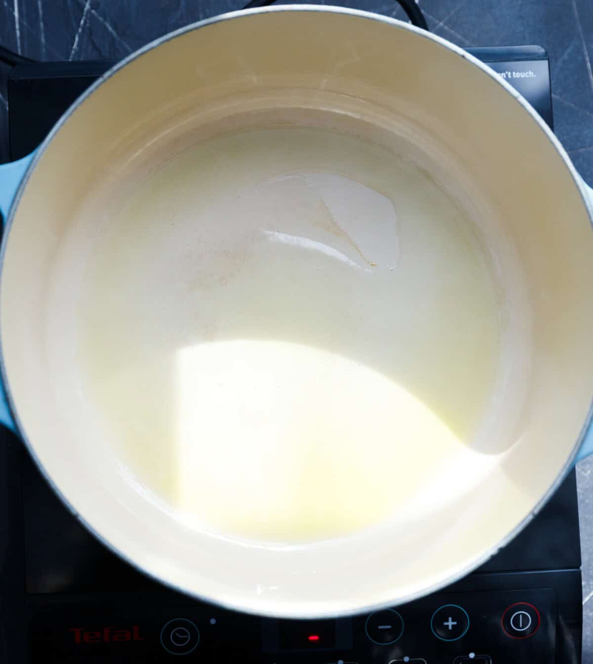 A Dutch oven with oil inside