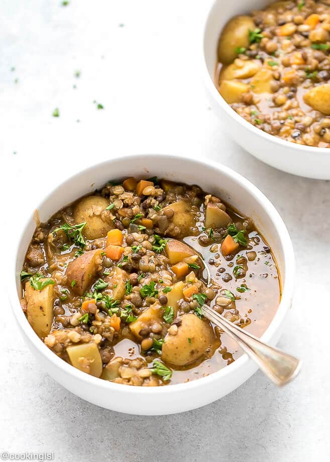 Lentil Potato Soup Recipe. Chunky brown soup in white bowls. Perfect for winter.