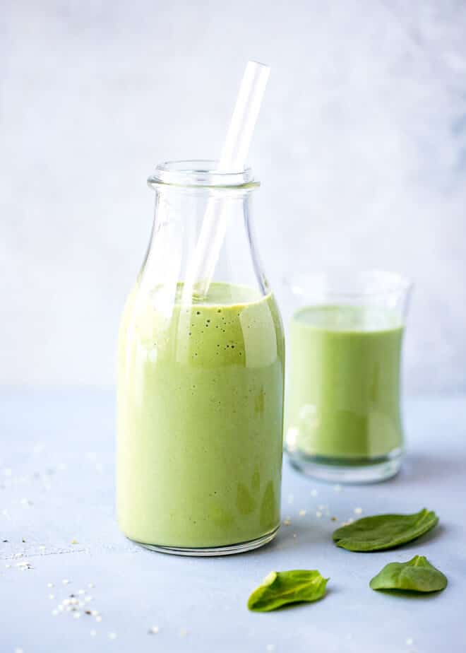 Spirulina Smoothie Recipe - in a tall jar, with a clear straw, loaded with superfoods.