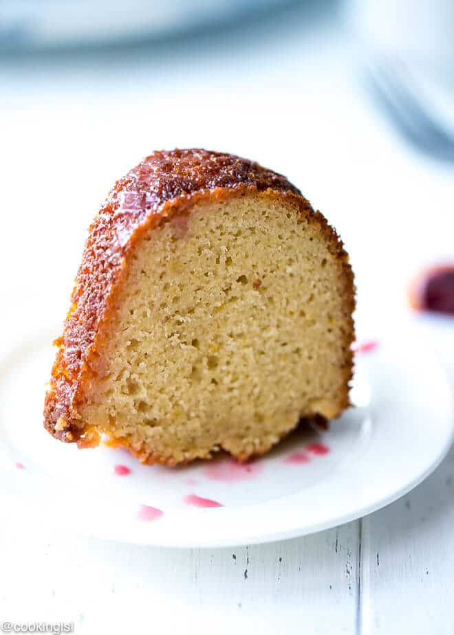 Blood Orange Bundt Cake- a slice of blood orange bundt pound cake on a plate. Moist, tender, fine crumb, easy to make.