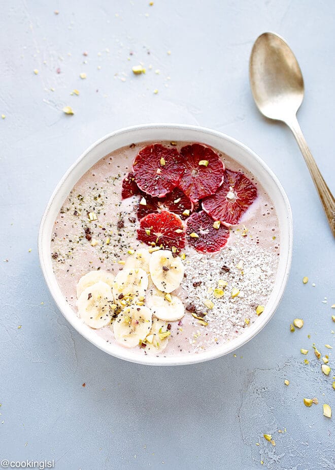 Blood Orange Smoothie Bowl Recipe -thick smoothie, full of antioxidants, vitamins, protein in a bowl with a spoon.