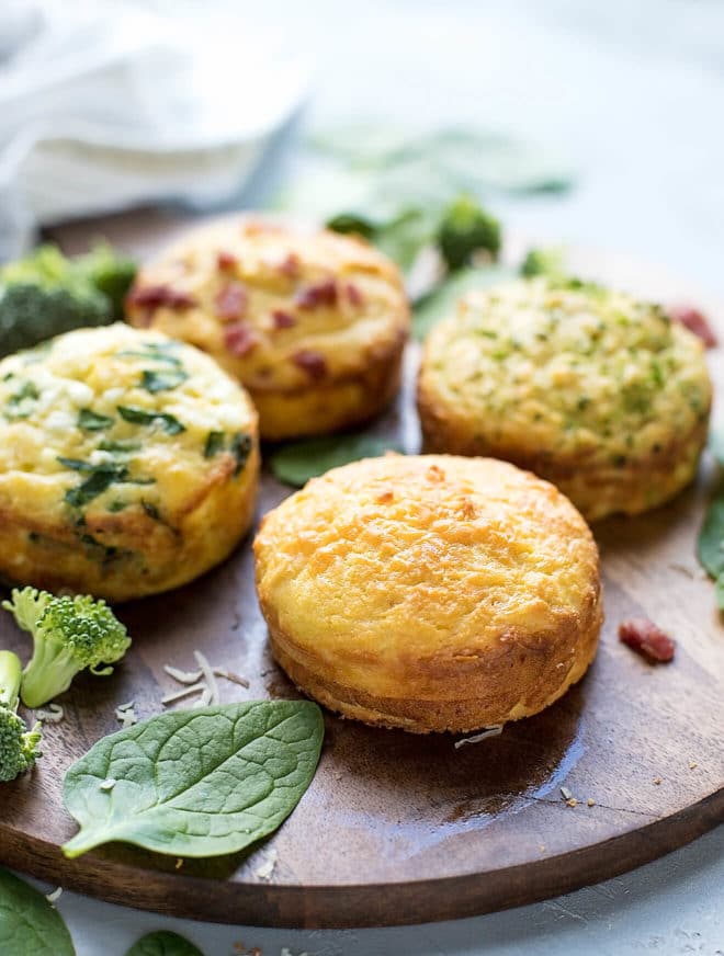 Cheese keto bread muffins on a wooden cutting board