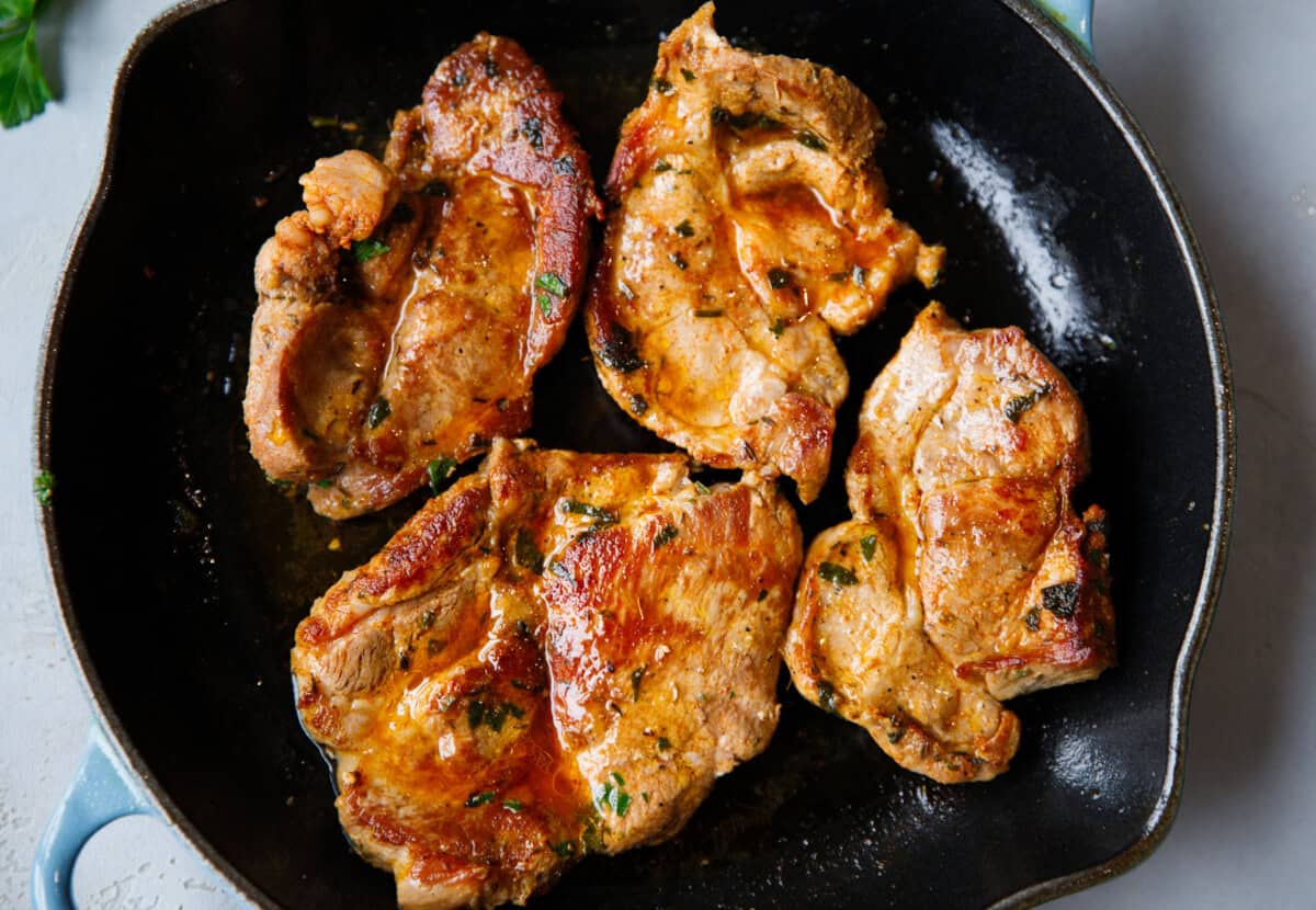 Juicy pork shoulder steak close up showing caramelized crust