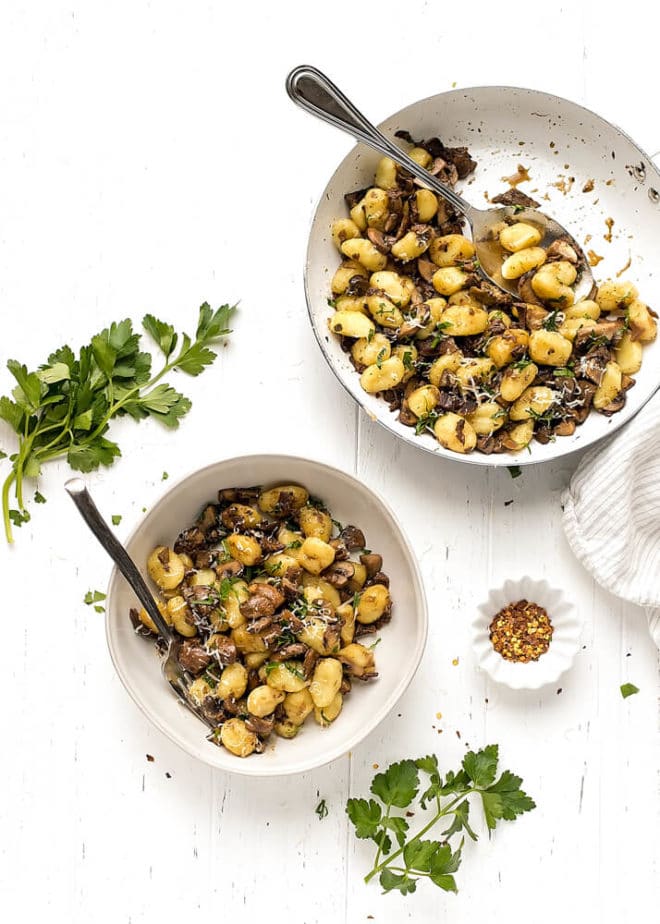 Bowls with gnocchi with mushrooms