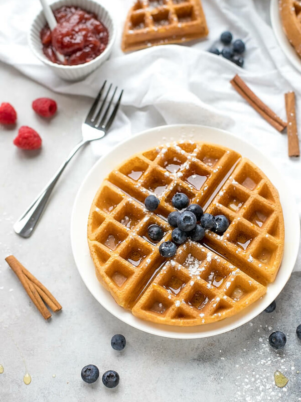 Crispy Belgian Waffles Recipe on a plate topped with blueberrier