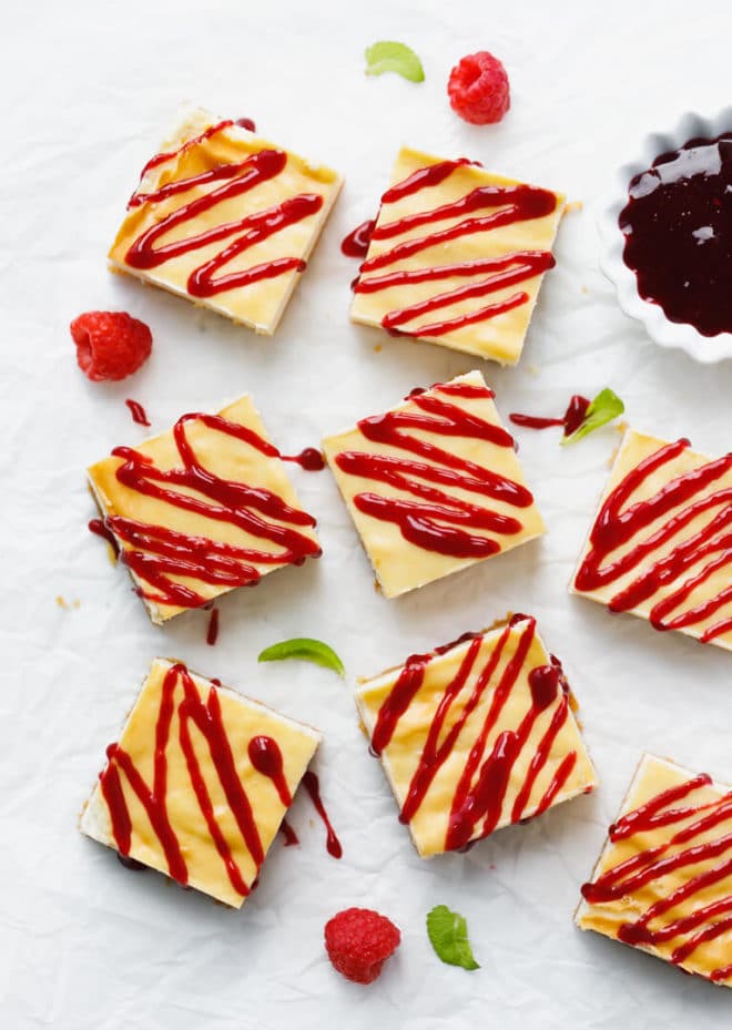 Raspberry Cheesecake Bars - Sugar-Free, Low-Carb, Keto, Gluten-Free drizzled with sauce